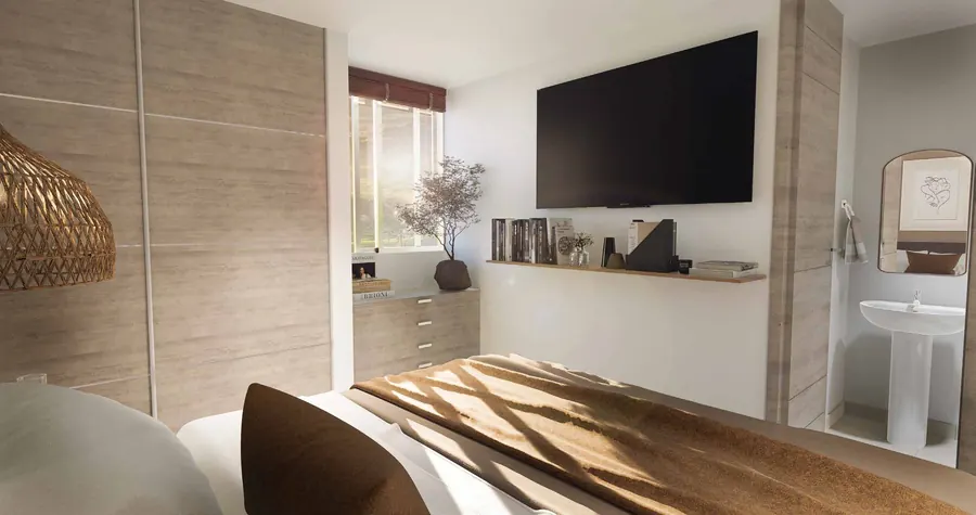 Habitación del apartaestudio con clóset y televisor